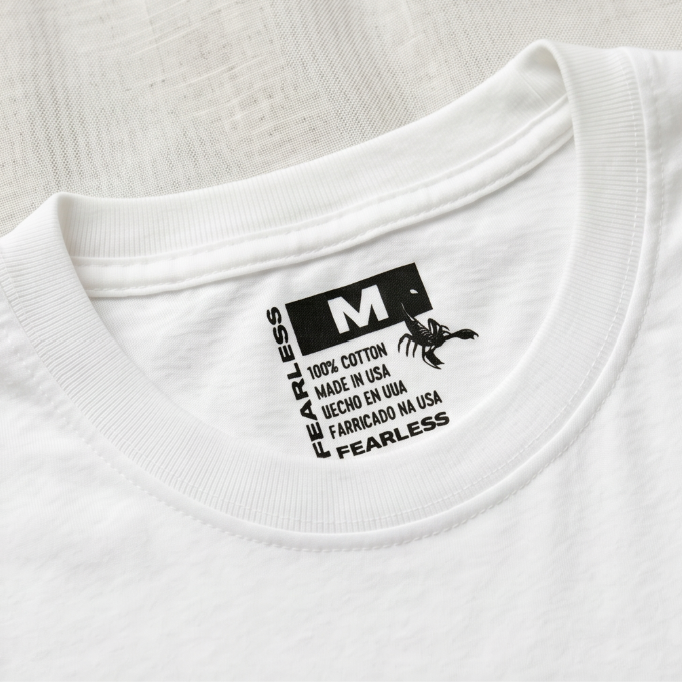 White t-shirt with a black label on the collar