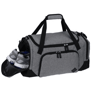 Gray duffel bag with black accents containing a pair of shoes on a white background